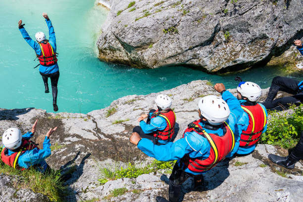 istock Friends standing on edge of cliff 1401891362