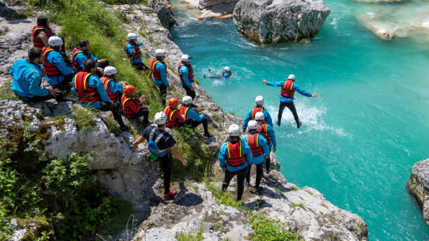 istock Friends standing on edge of cliff 1401891364
