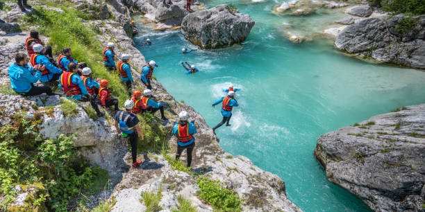 istock Friends standing on edge of cliff 1401891372