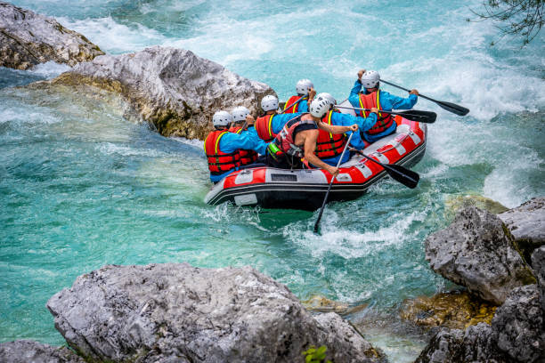 friends rafting in river - inflatable raft imagens e fotografias de stock