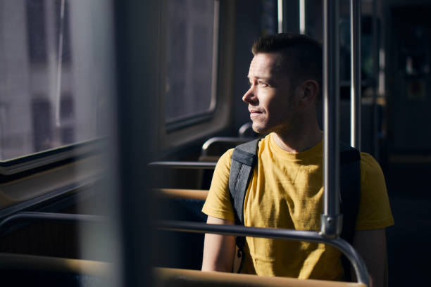 istock Pensive man looking out of window of train 1401894113