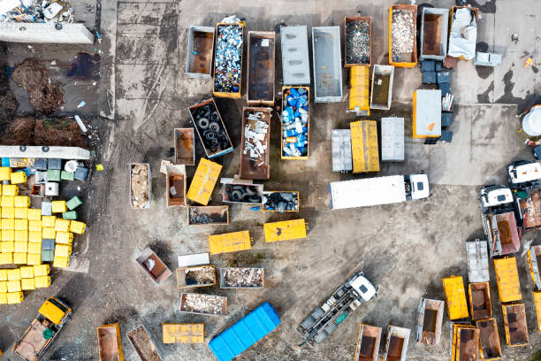 istock Top view of a landfill with various waste. Many dumpsters and garbage trucks sorting and recycling garbage in the industrial areas of the city 1401894156