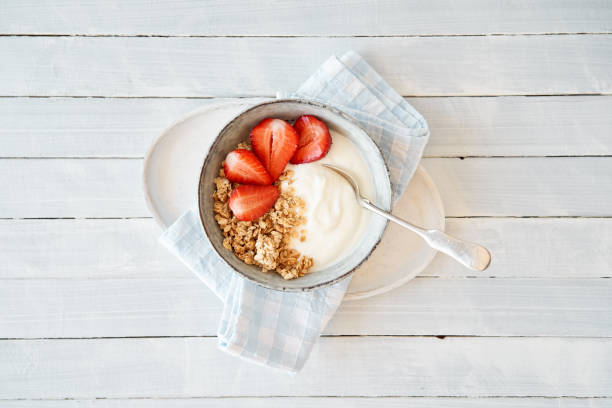 Granola with curd cheese and strawberries Granola with curd cheese and strawberries in a bowl food fruit close up strawberry stock pictures, royalty-free photos & images