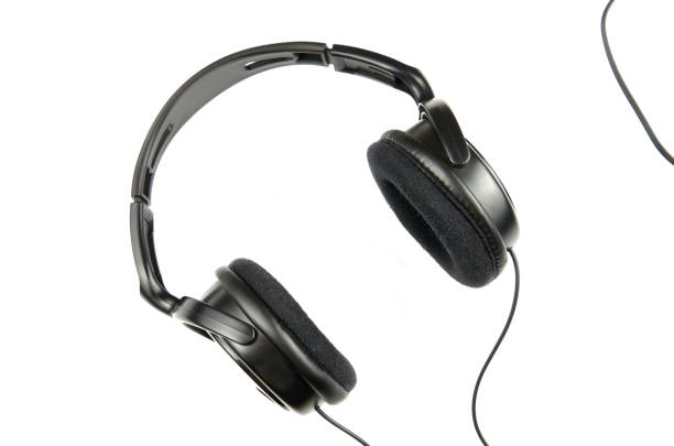 black headphones on a white background upside down, left and right headphones with a frame rim for listening to loud music close-up