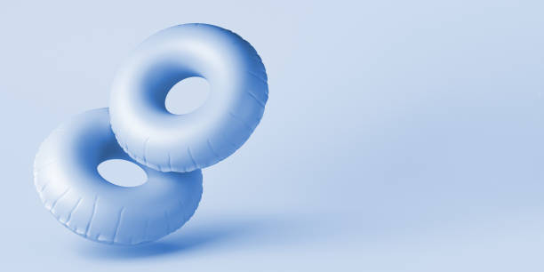 istock Summer concept with two inflatable ring floats. Copy space. 3D illustration. 1401895236