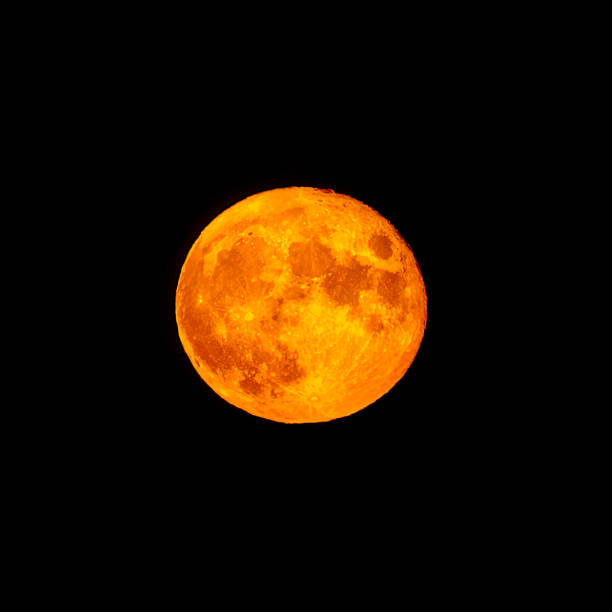 Red full moon in red color also called bloodmoon Bright orange and red fool moon over the sea. Red full moon in red color also called bloodmoon fool moon stock pictures, royalty-free photos & images