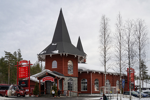 Santa's Village, Finland - March 20th, 2022: Tourist at the entrance to the Santa Claus holiday village hotel, Finland.