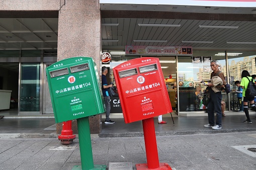 Post boxes bent during typhoon in Taipei, Taiwan. The twisted mailboxes are a popular local landmark.