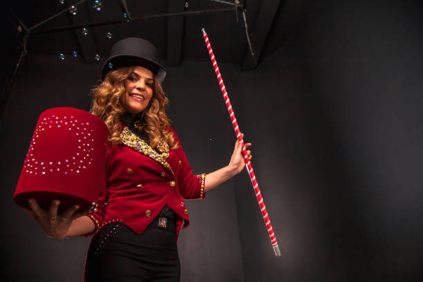 istock Female magician makes with soap bubbles show, an illusionist 1401898045