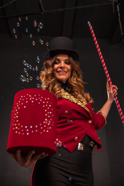 istock Female magician makes with soap bubbles show, an illusionist 1401898070