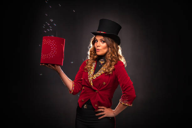 istock Female magician makes with soap bubbles show, an illusionist 1401898072