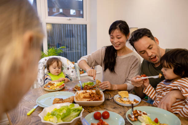 istock Family Enjoying Delicious Dinner 1401898472