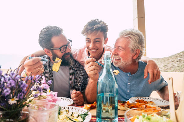 istock Cheerful Family Eating Food While Sitting At Restaurant 1401899189