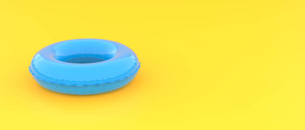 istock Blue swim ring on yellow background with copy space for text. Minimal summer concept. Colorful summer Banner. 1401899606