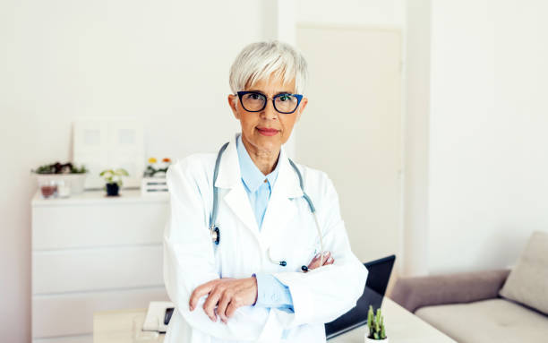 istock Female mature doctor with stethoscope. 1401900601