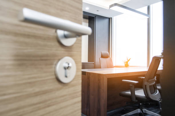 istock Half opened door into the manager's Office interior 1401900991