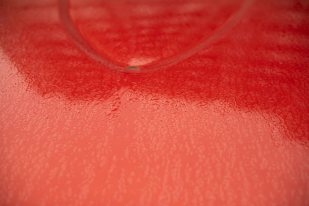 Wet transport in detail. Drops on car. Car is parked.