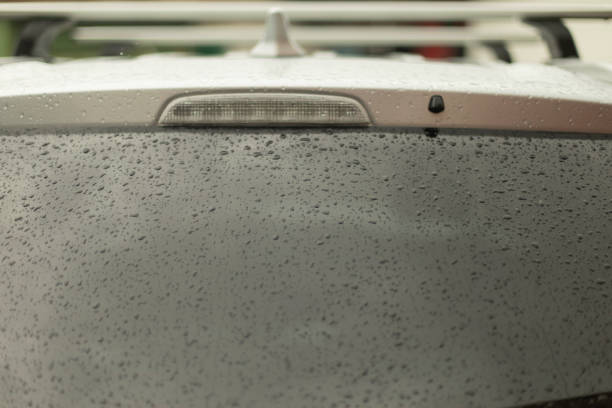 istock Raindrops on car window. Wet rear window. Transport in bad weather. 1401902084