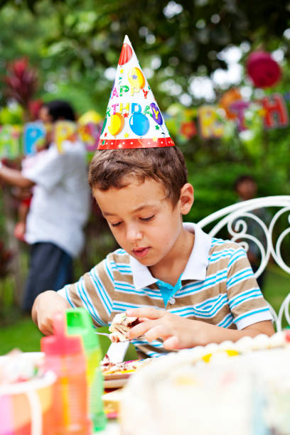 istock Child eting on a Birthday party 1401903600