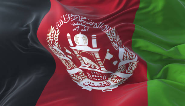 afghanistani flag waving at wind in slow with blue sky - flag of afghanistan imagens e fotografias de stock