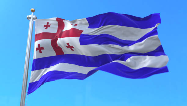istock Adjara flag waving at wind in slow with blue sky 1401904542