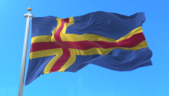 Aland Islands Flag waving at wind in slow with blue sky