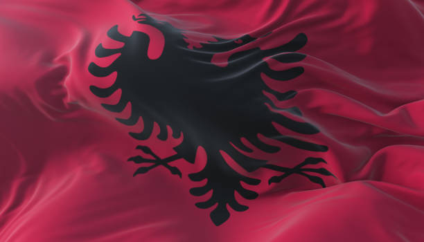 istock Albanian flag waving at wind with blue sky 1401904550