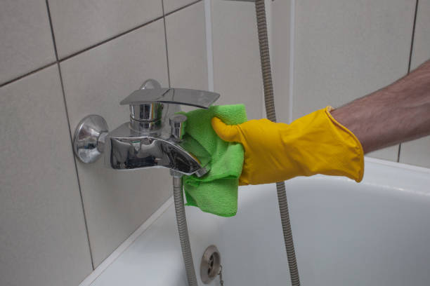 istock Cleaning tap from limescale in bathroom, disinfecting surface from contamination 1401913334