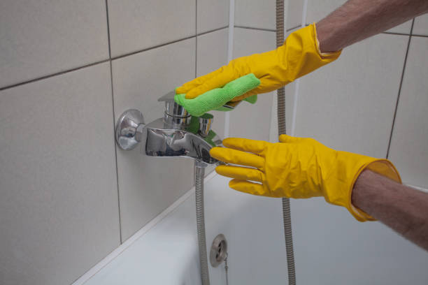 istock Hands washes the faucet with cloth close up 1401913444