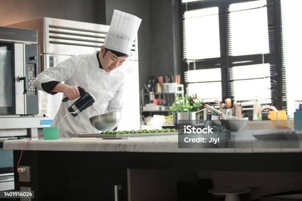 Male Chinese Pastry Chef Making Desserts Stock Photo Stock Photo - Download Image Now