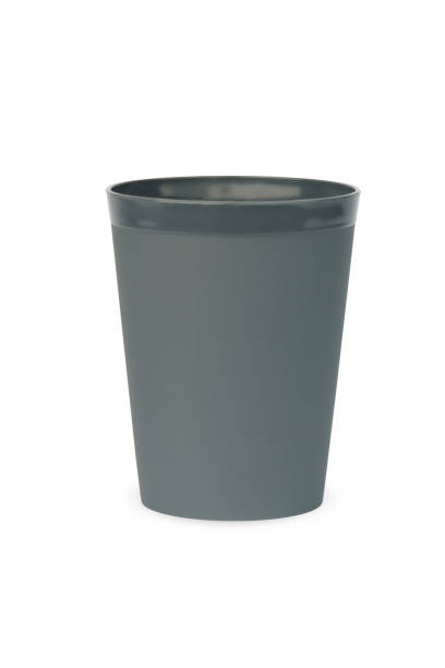istock one plastic glass isolated on white background. 1401918763