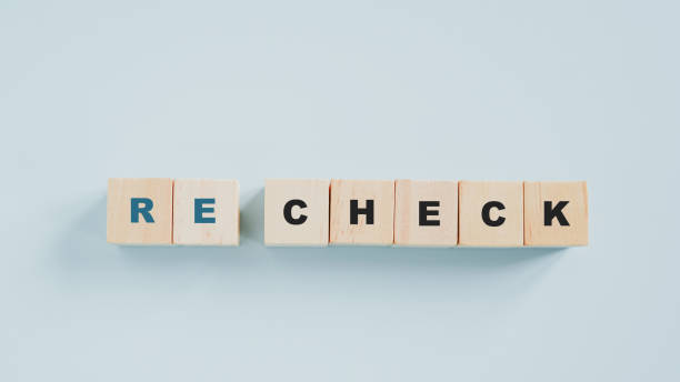 istock wooden cube blocks with the word RE CHECK  on pastel blue background 1401918990