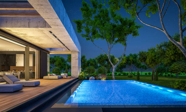 istock 3d rendering of new concrete house in modern style in night 1401920013