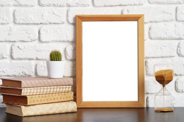 istock Books with picture frame on wooden table 1401921178