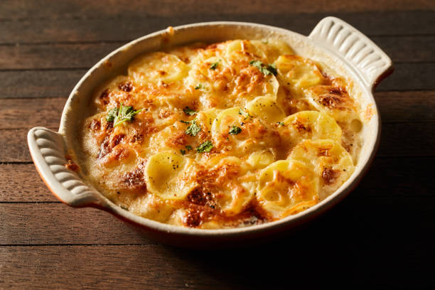 istock Delicious baked potato with cheese in ceramic dish 1401921628
