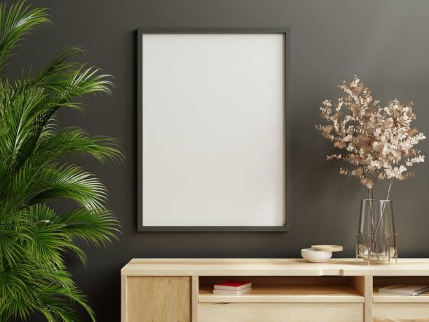 istock Mockup frame on wood cabinet in living room interior on empty dark wall background. 1401922996