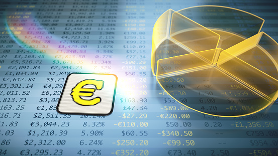 Abstract pie chart in transparent yellow color on financial figures spreadsheet table with the Euro currency symbol. Top view, close up composition.