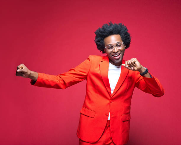 istock Businessman in red blazer enjoying while dancing 1401924040