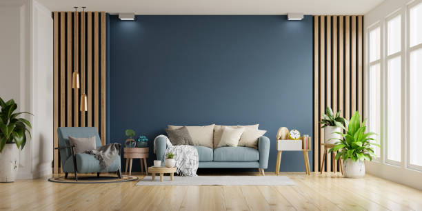 istock Interior of light room with sofa and armchair on empty dark blue wall background. 1401924923