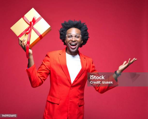 Cheerful Businessman Holding Gift Box Stock Photo - Download Image Now - Birthday, Cut Out, Red