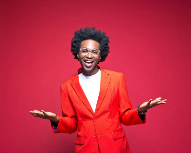 istock Happy businessman gesturing against red background 1401926039