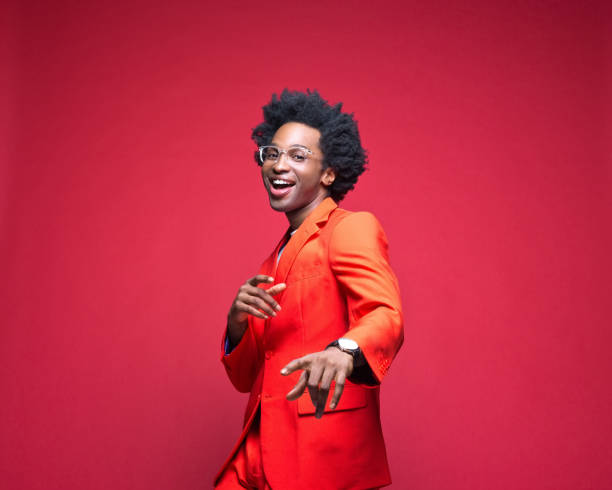 istock Happy businessman in red blazer dancing 1401926261