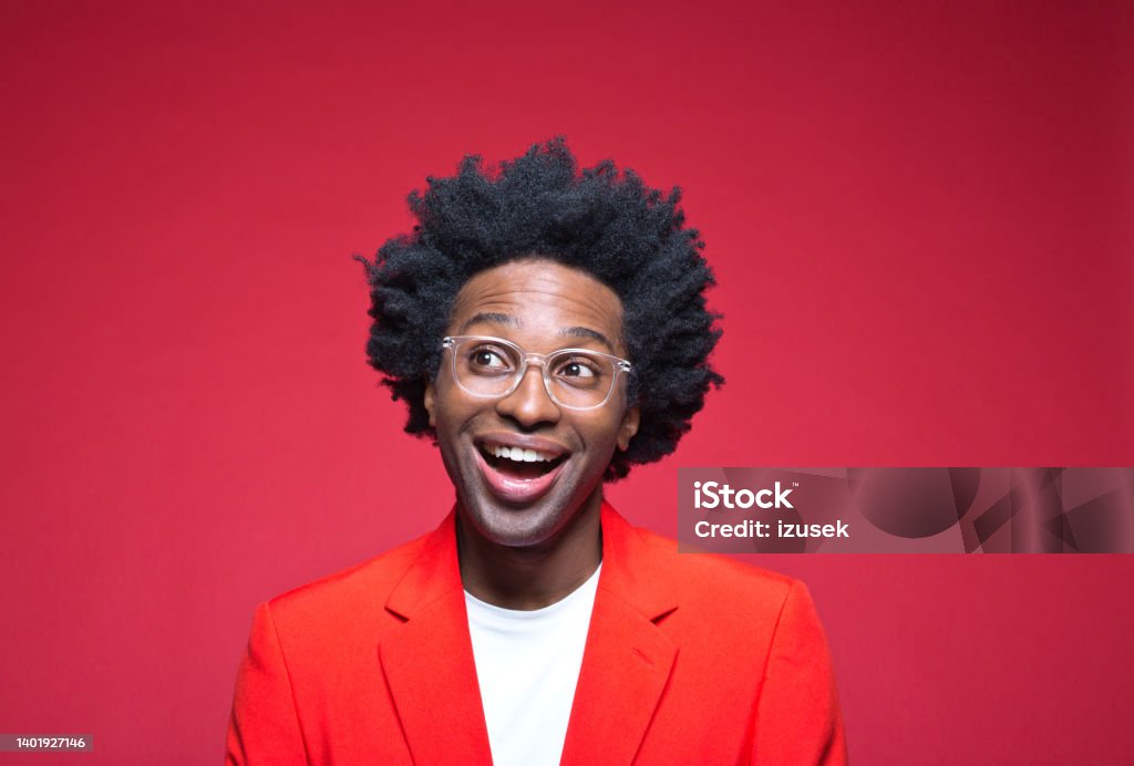 Happy businessman looking away Businessman day dreaming while looking away against red background 30-34 Years Stock Photo