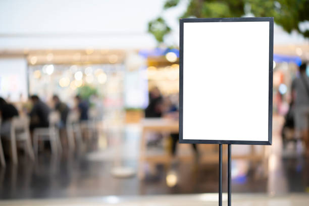 istock mockup white poster with black frame stand in front of blur restaurant cafe background for show or present promotion 1401927202