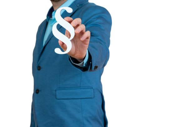 businessman holding paragraph symbol - law concept
