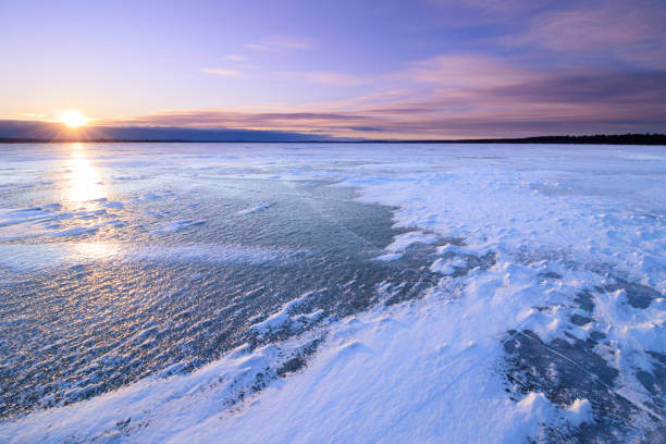 istock Sunset on a frozen Higgins Lake, Michigan 1401929183