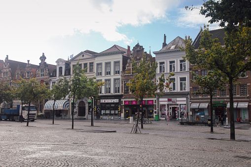 Ghent, Belgium - 10 04 2012: Local shopping market at Sint-Jacobskerk church market place in Ghent, Belgium.