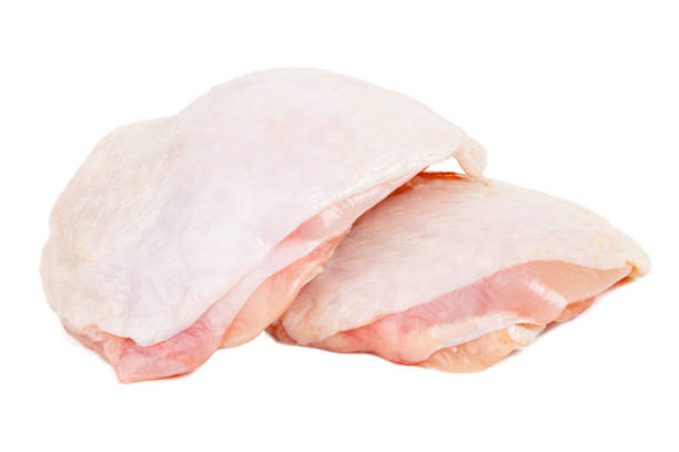 chicken thigh meat isolated on white background. - thigh imagens e fotografias de stock