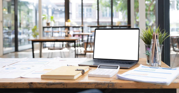 istock Laptop or notebook with blank screen on wood table in blurry background with house or office modern ,nature orange bokeh and sunlight in morning. 1401936954