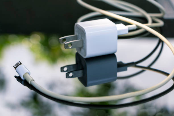White chargin cable  of mobile phone on the table with selective focus.